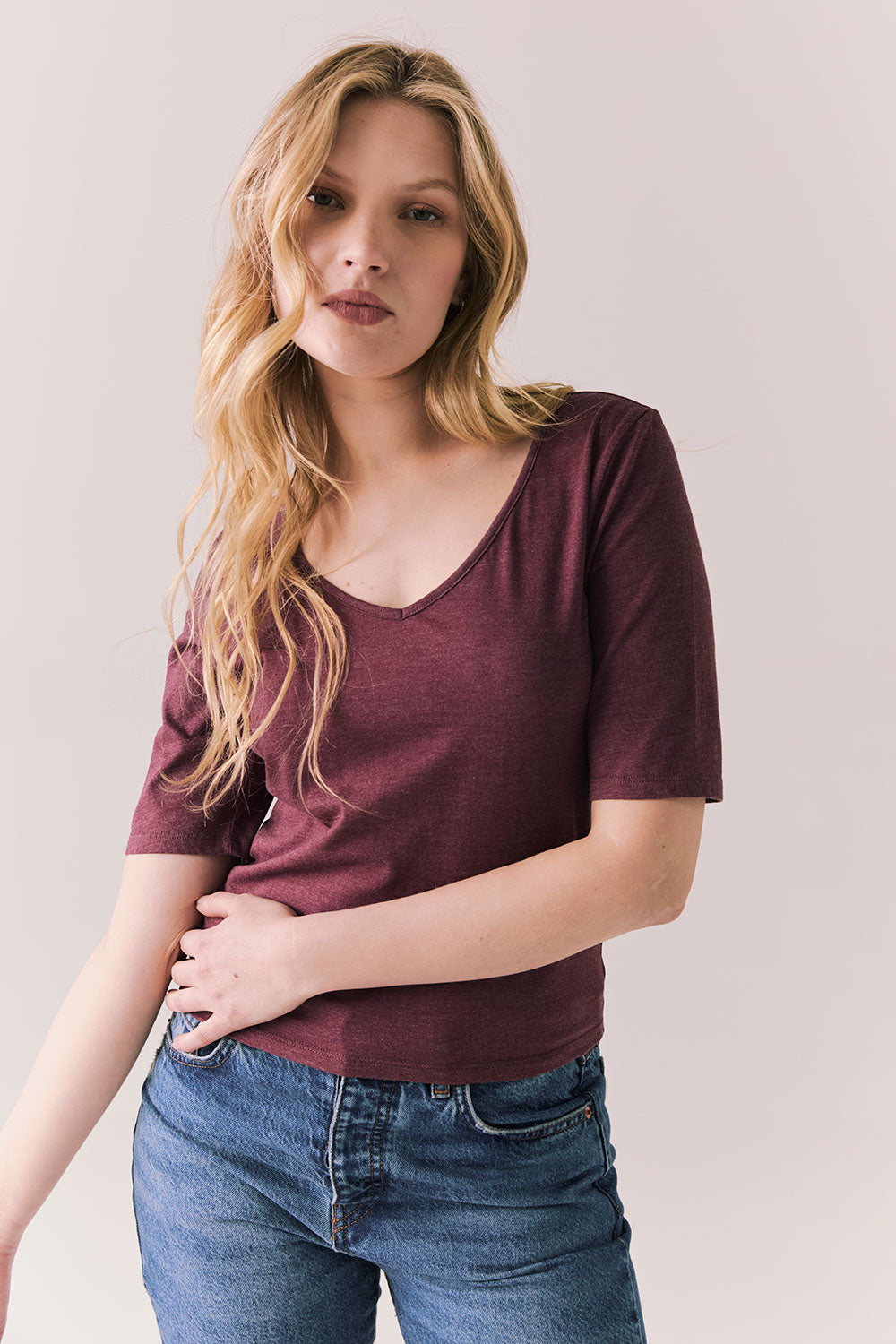 Front view of Fresno tee in fig with scoop neck and fitted silhouette on a plain background