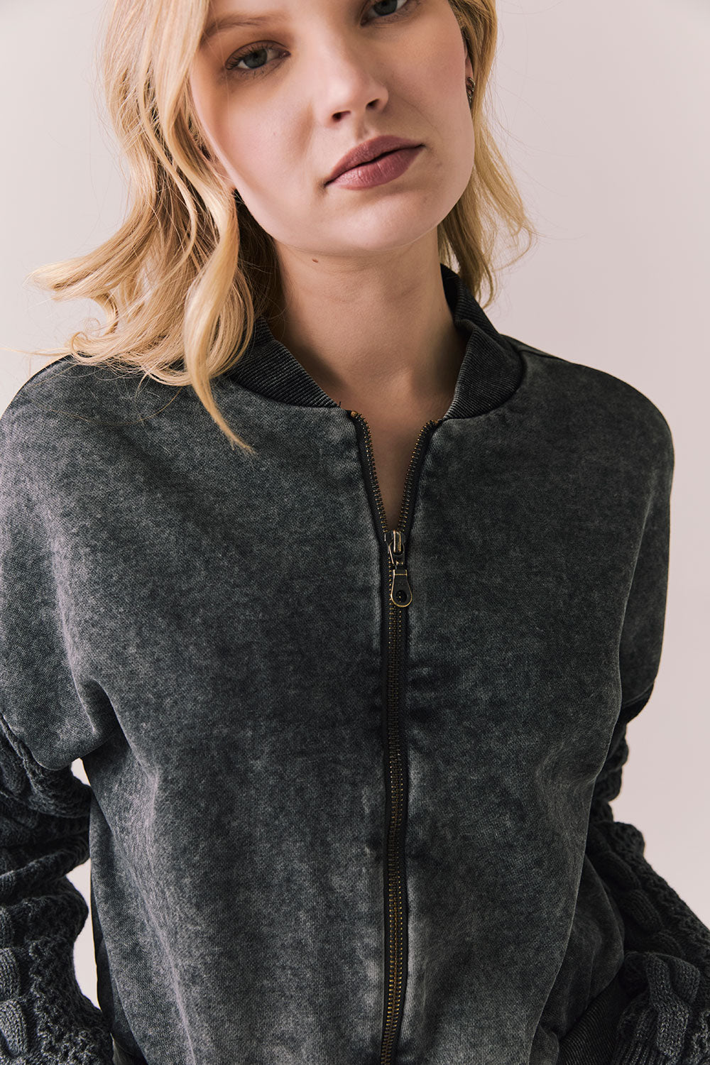 Front view of Fullerton hoodie in True Black with oversized silhouette with black jeans on a plain background