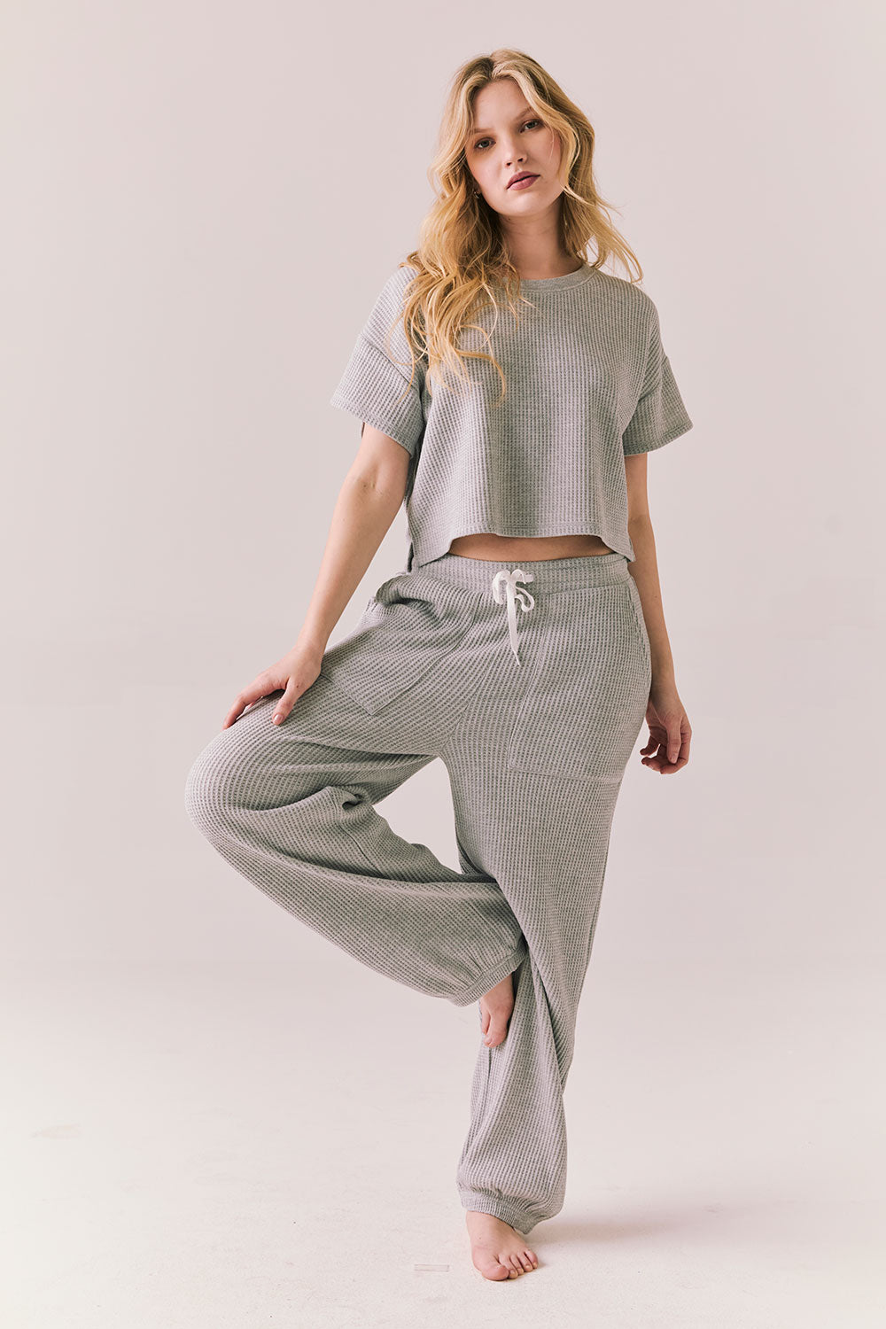 Full body view of model in Billyy Joggers in heather grey