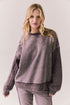 Front view of Maritime Pullover in fig (deep purple) with relaxed fit and knit texture against a plain background
