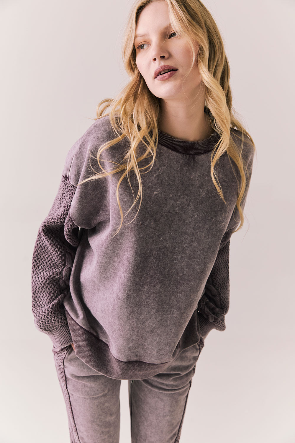 Front view of Maritime Pullover in fig (deep purple) with relaxed fit and knit texture against a plain background
