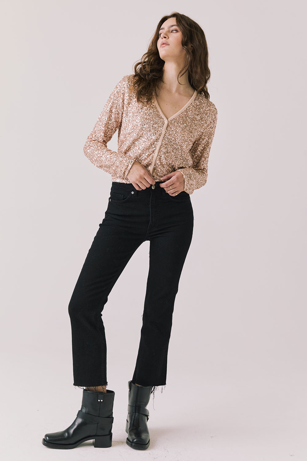 Full body view of woman wearing Chaser’s Sparrow Bronze Brown Long Sleeve button-up with black pants and black boots on a white background