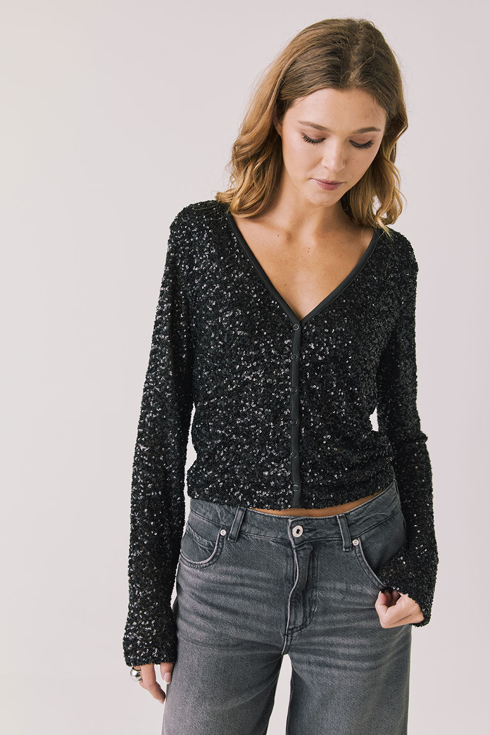 Front view of woman wearing Chaser’s Sparrow True Black Button-Up Long Sleeve on a white background