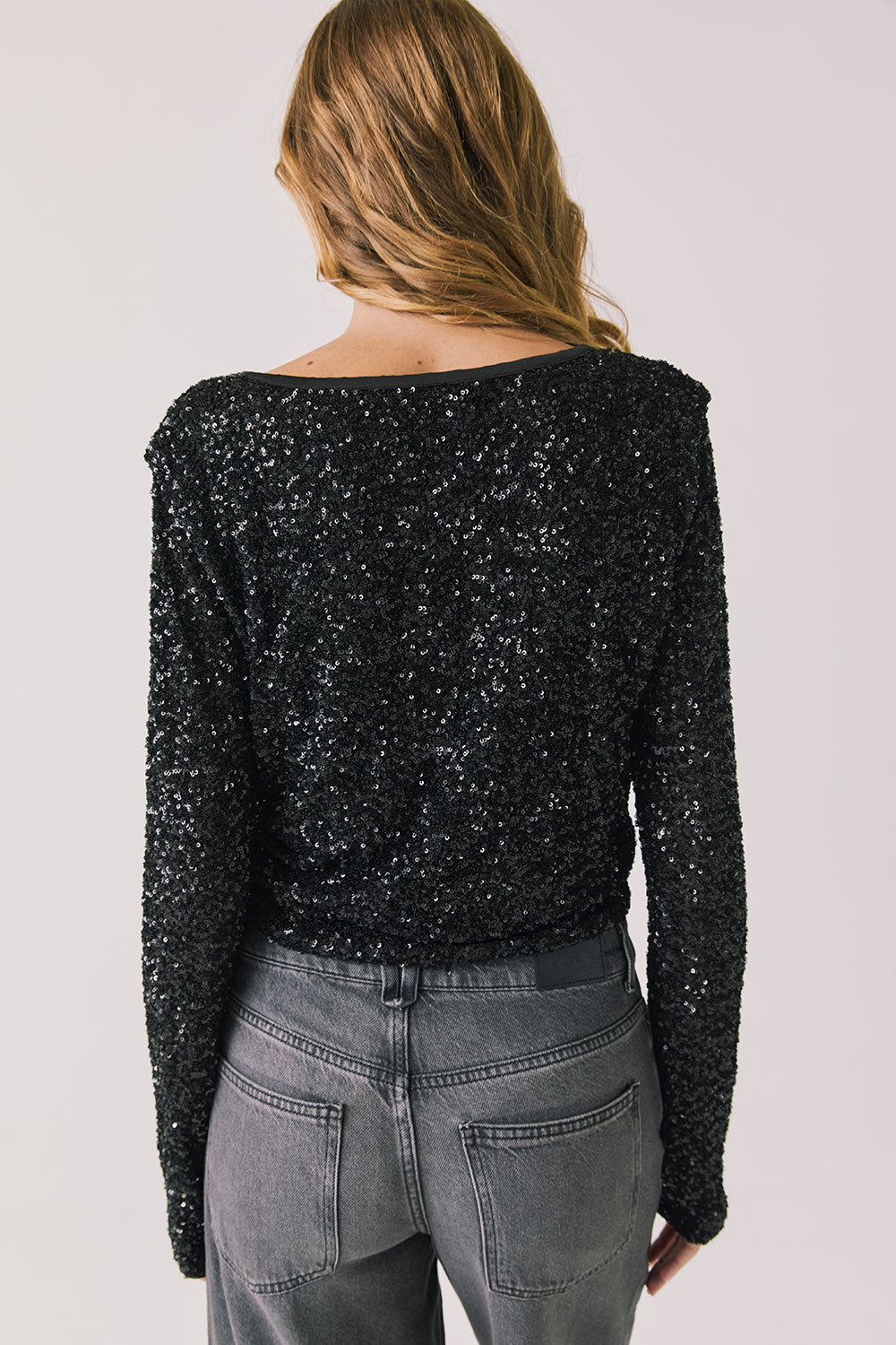 Back view of woman wearing Chaser’s Sparrow True Black Button-Up Long Sleeve on a white background
