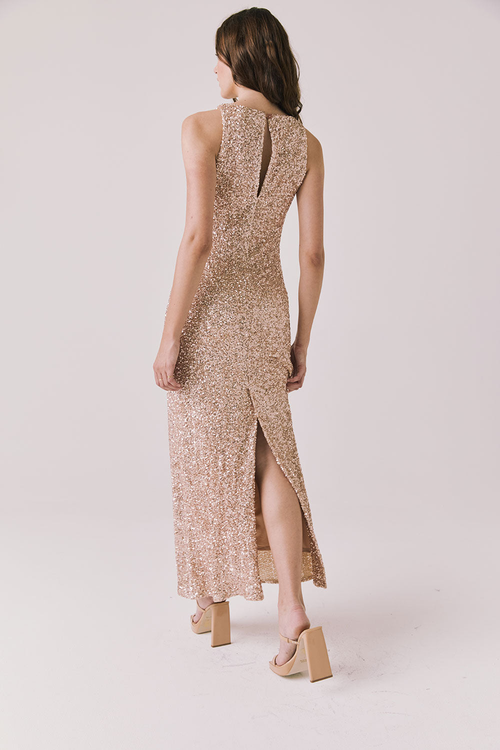 Full body back view of woman wearing Chaser’s Faye Bronze Brown Dress on a white background