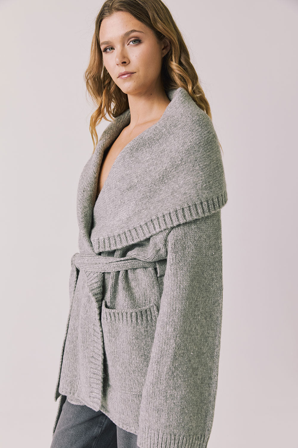 Side view of woman wearing Chaser’s Eclipse Heather Grey Cardigan Robe on a white background