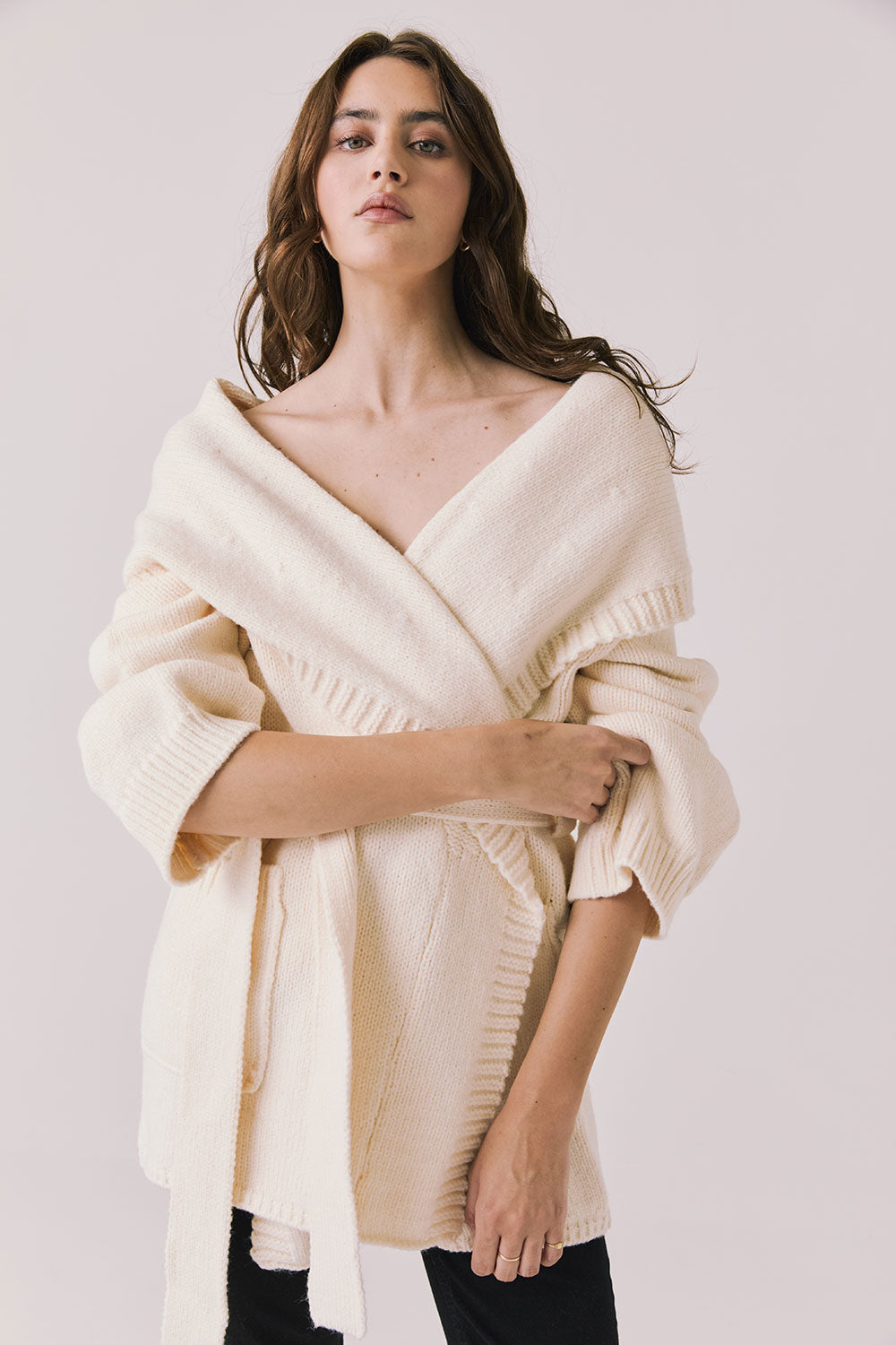 Front view of woman wearing Chaser’s Eclipse Warm White Cardigan Robe on a white background