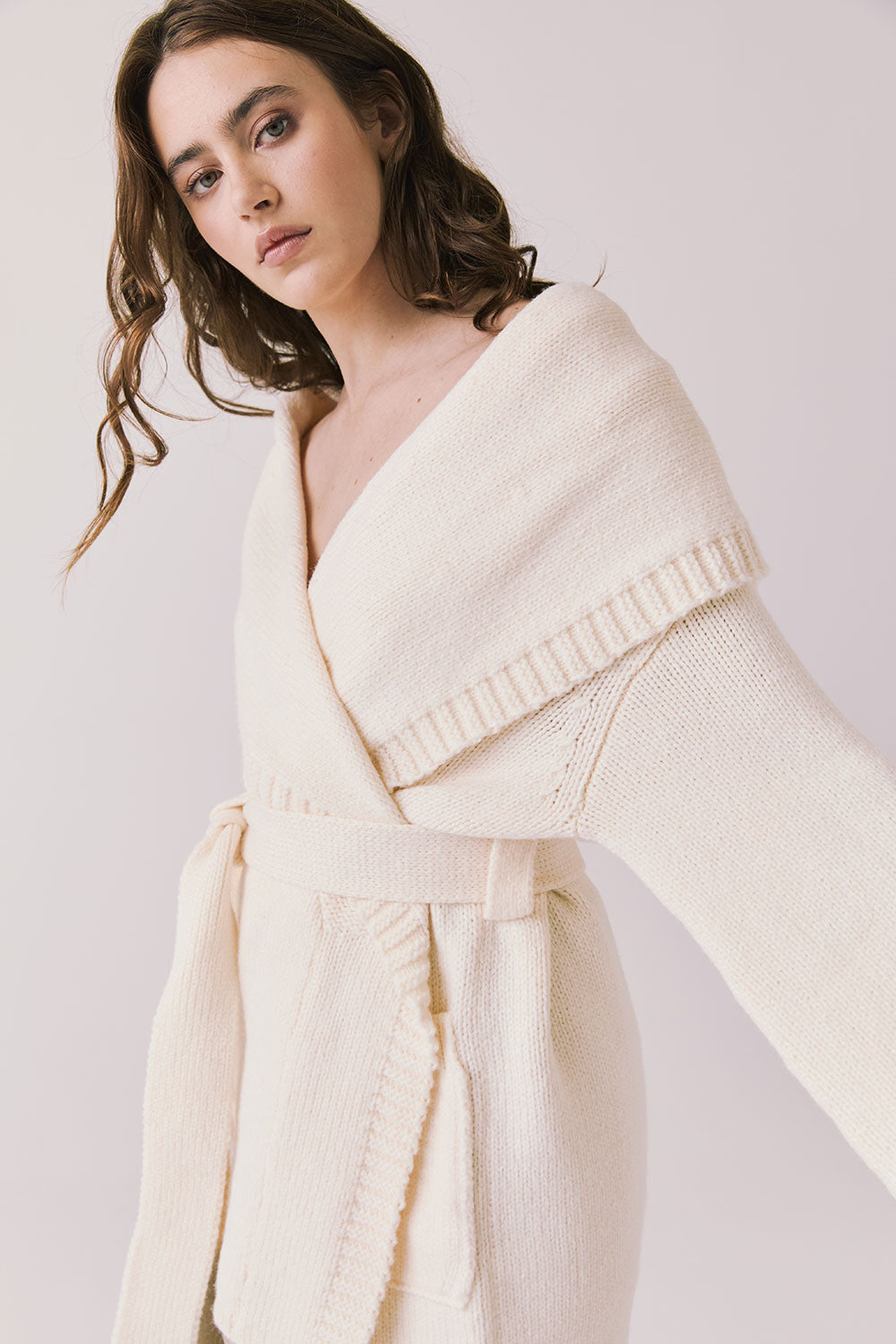 Side view of woman wearing Chaser’s Eclipse Warm White Cardigan Robe on a white background