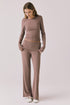 Full body view of woman wearing Chaser’s Deep Taupe Mantra Legging with matching Porta Deep Taupe Long Sleeve on a plain background
