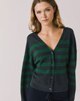 Front view of woman wearing Chaser’s Timeless Stripe Maison Cardigan Sweater on a white background