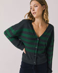 Front view of woman wearing Chaser’s Timeless Stripe Maison Cardigan Sweater on a white background
