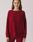 Front view of woman wearing Chaser’s Miller Purple-Red Fig Pullover Sweater on a white background