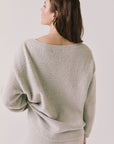 Back view of woman wearing Chaser’s Miller Heather Grey Pullover Sweater on a white background