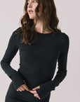 Front view of woman wearing Chaser’s Porta True Black Long Sleeve top on a white background
