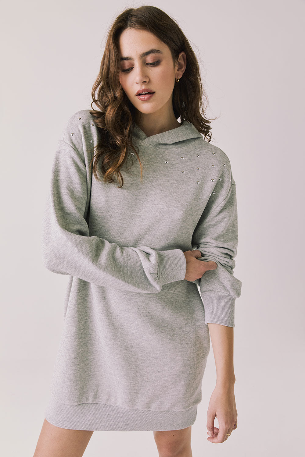 Woman wearing Chaser's Aster Heather Grey Hoodie Dress on a plain background