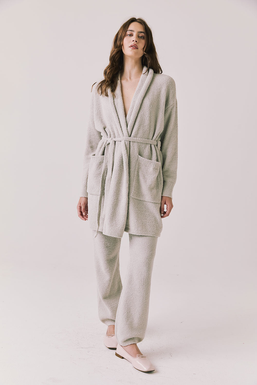 Full body view of woman wearing Chaser’s Cozy Heather Grey Robe and matching Monica Heather Grey joggers on a white background