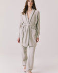Full body view of woman wearing Chaser’s Cozy Heather Grey Robe and matching Monica Heather Grey joggers on a white background