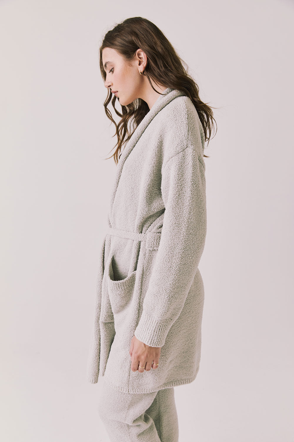 Side view of woman wearing Chaser’s Cozy Heather Grey Robe with tie waist on a white background