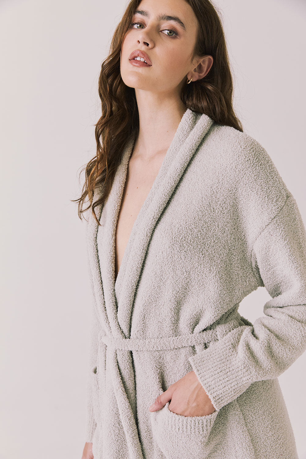 Side view of woman wearing Chaser’s Cozy Heather Grey Robe with tie waist on a white background