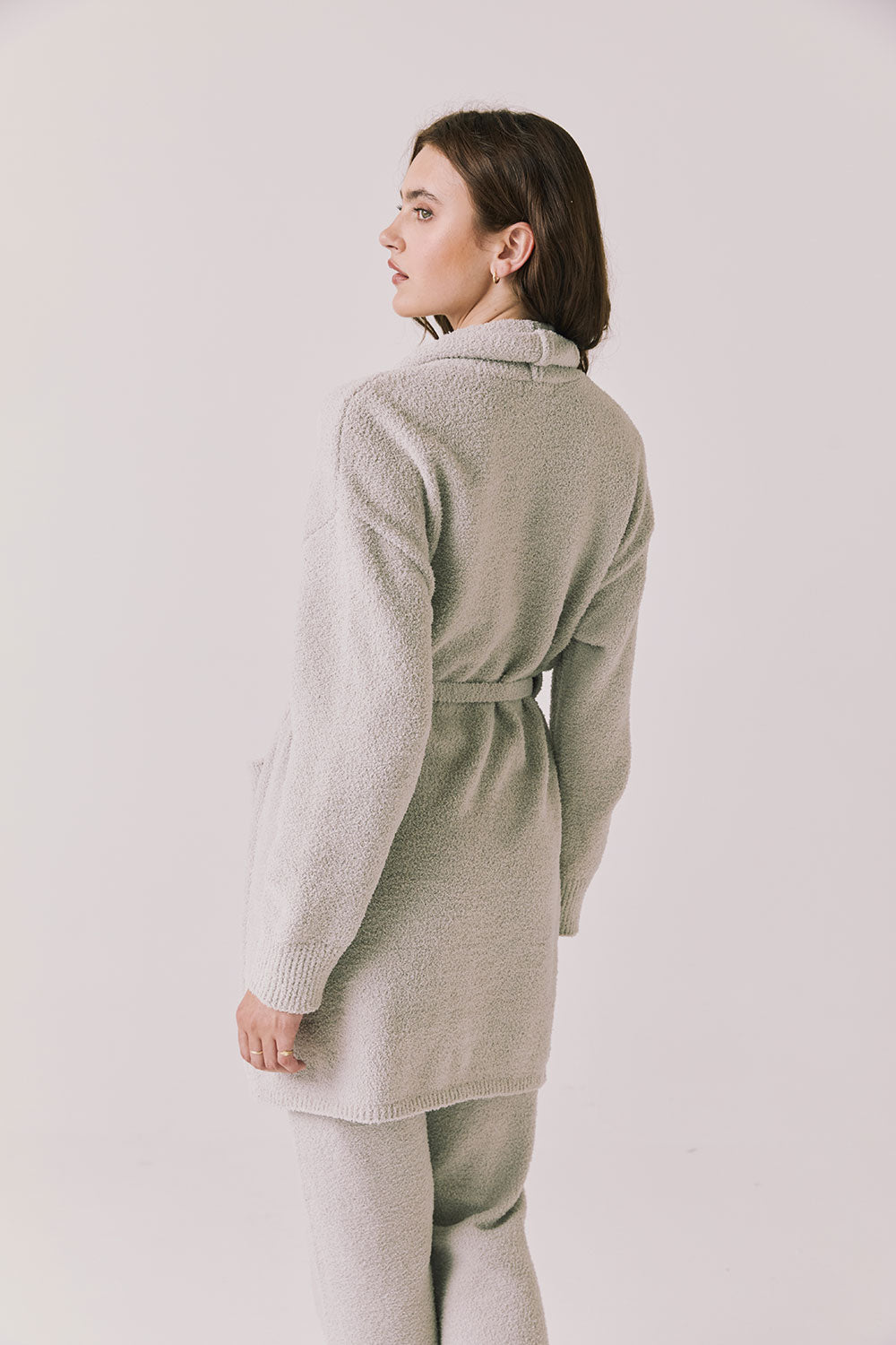 Back view of woman wearing Chaser’s Cozy Heather Grey Robe with hood and matching Monica Heather Grey joggers on a white background