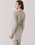 Back view of woman wearing Chaser’s Cozy Heather Grey Robe with hood and matching Monica Heather Grey joggers on a white background