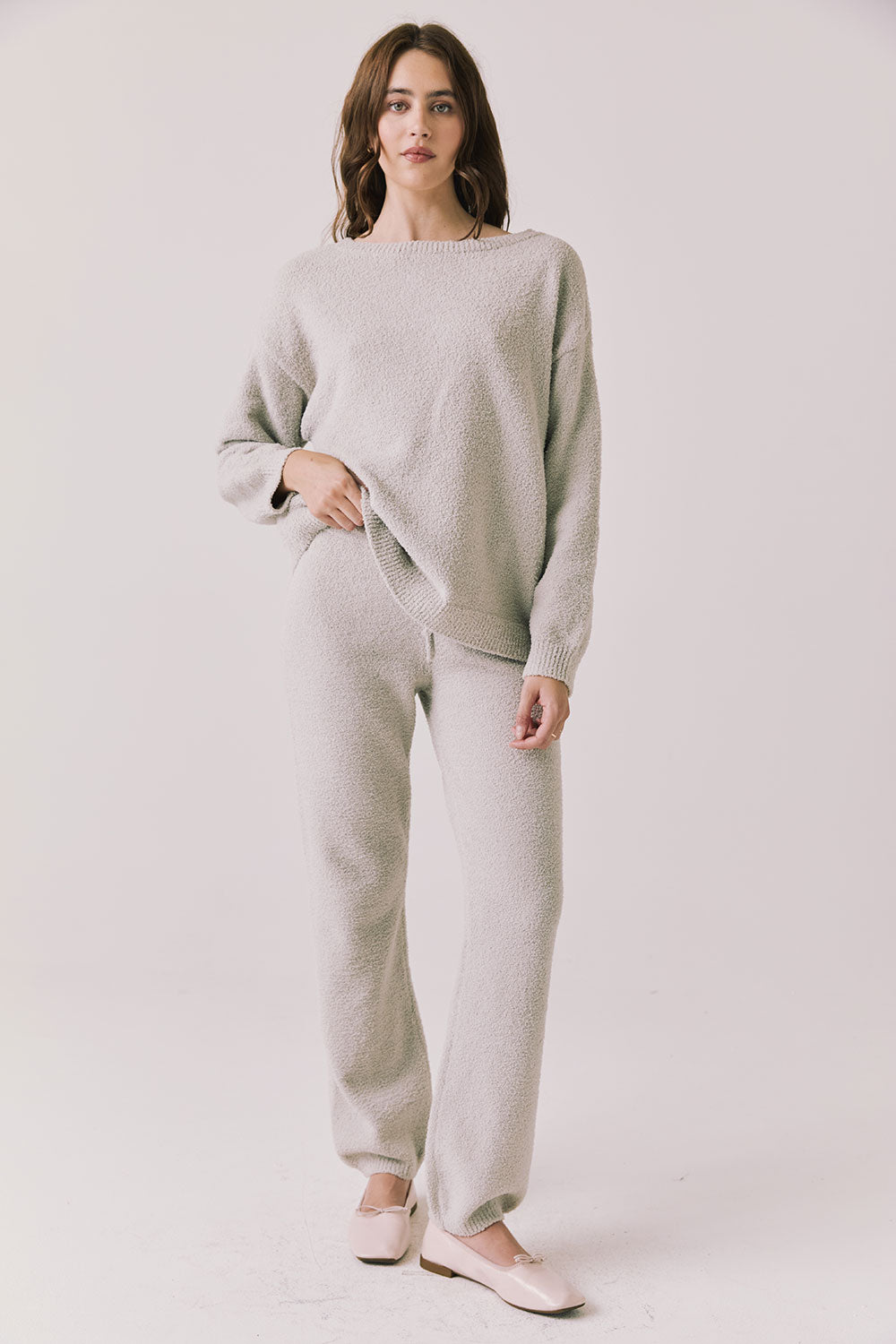 Full body view of woman wearing Chaser’s Monica Heather Grey Joggers with matching Miller Heather Grey Pullover Sweater on a white background