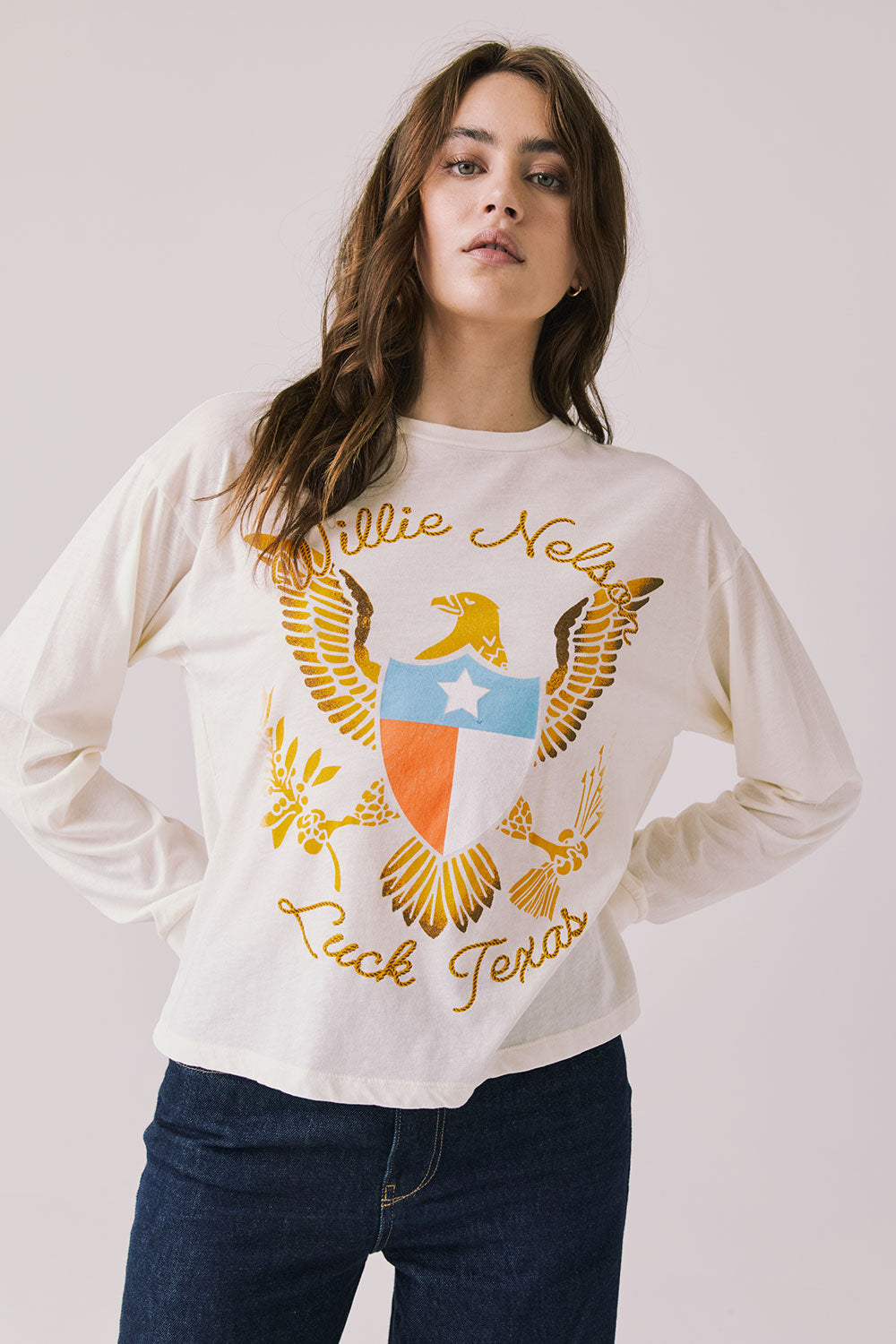 Front view of woman wearing Chaser’s starry white Willie Nelson Luck Texas Long Sleeve with vintage-style graphic design on a light background (licensed band collaboration)