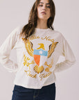 Front view of woman wearing Chaser’s starry white Willie Nelson Luck Texas Long Sleeve with vintage-style graphic design on a light background (licensed band collaboration)