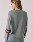 Back view of woman wearing Chaser’s Streaky Grey Merry Long Sleeve against a plain background