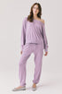 Woman wearing Chaser's Bellini Amethyst Purple Pullover with matching pants on a plain background
