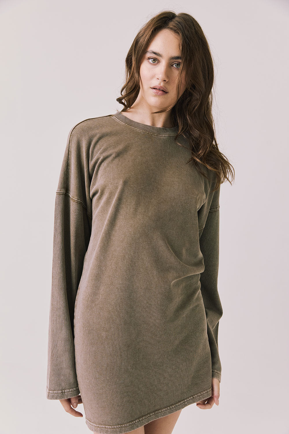 Front view of woman wearing Chaser’s Ginger Brown Margarita Mini Dress on a plain background