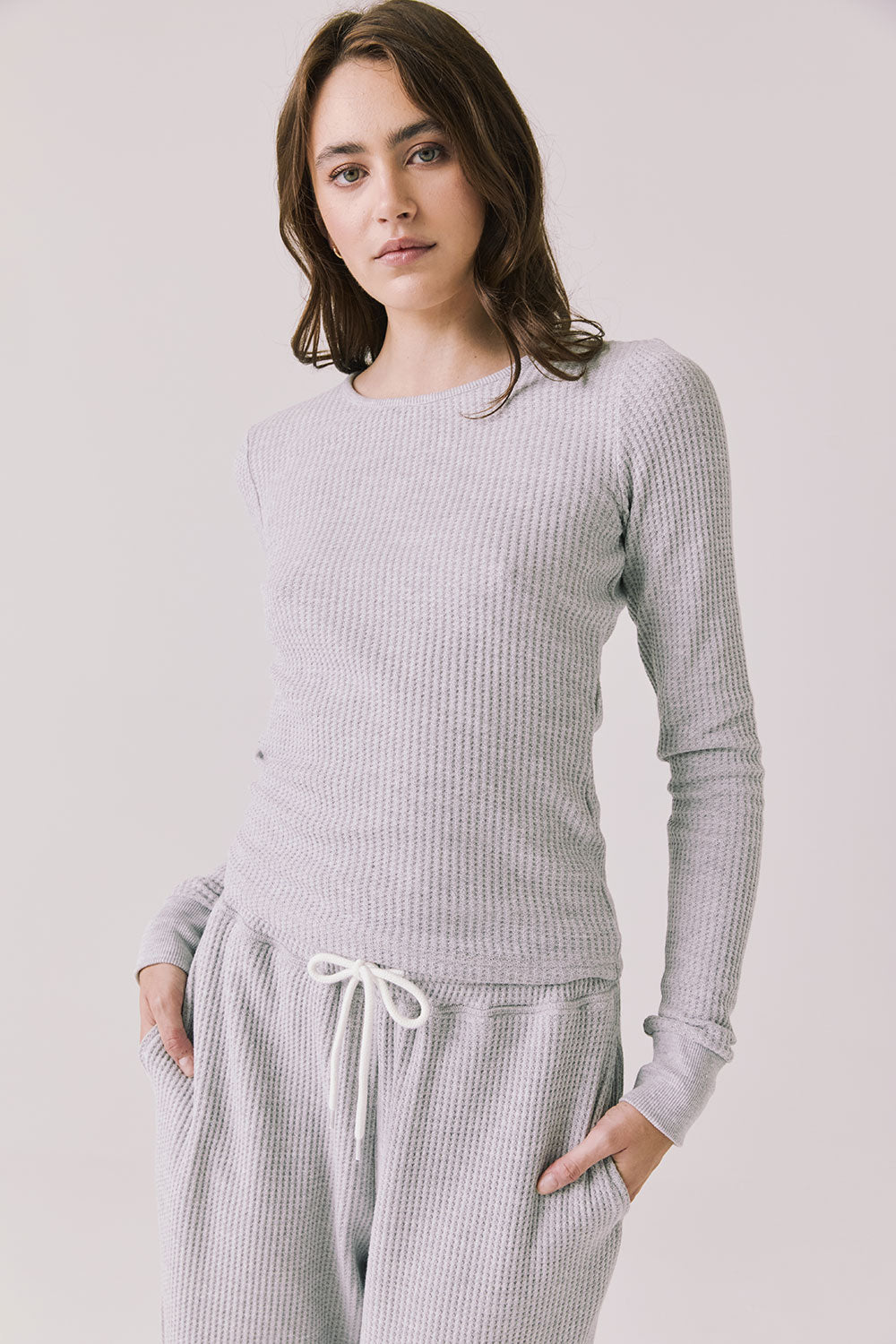 Front view of woman wearing Chaser’s Spritz Long Sleeve on a white background