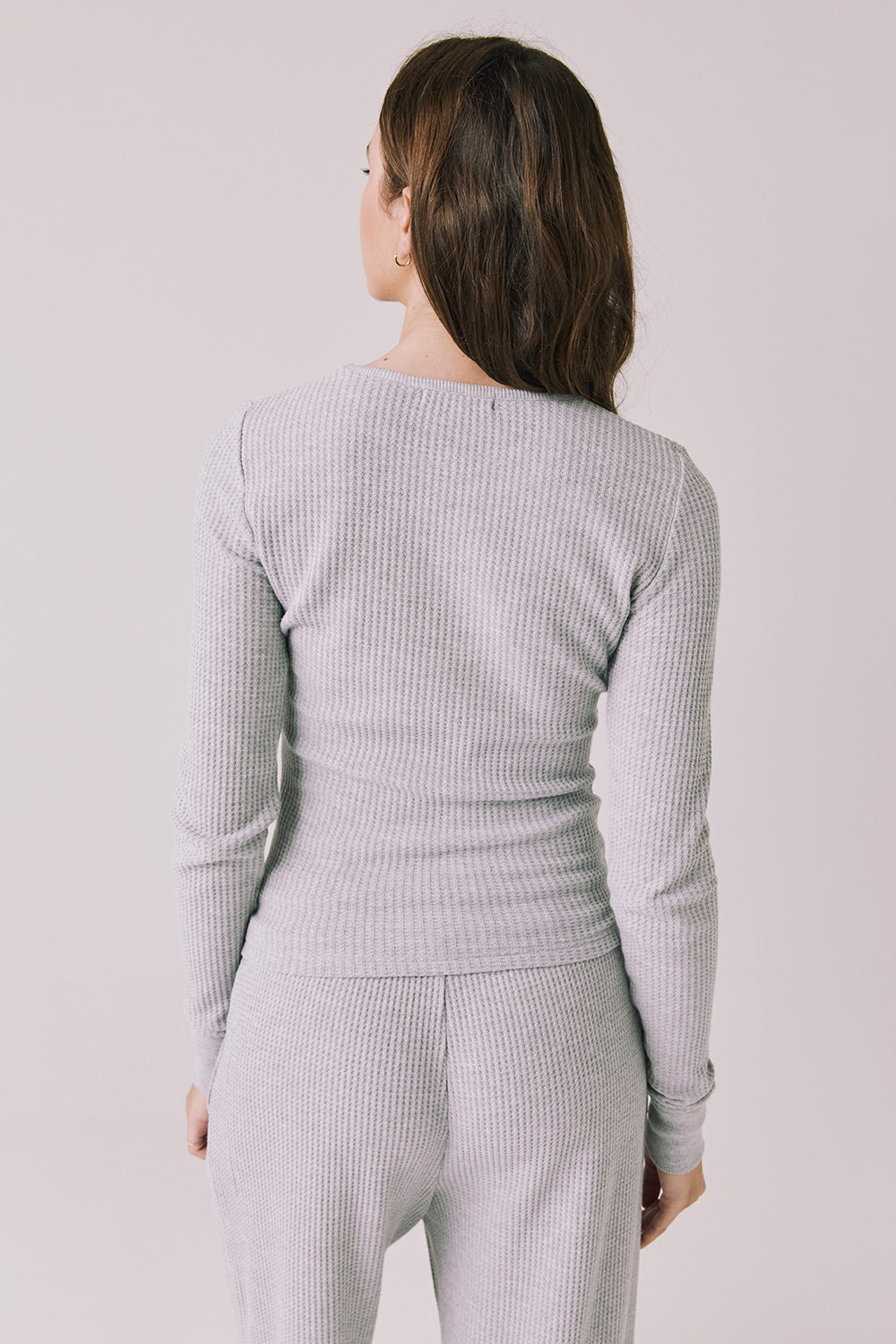 Back view of woman wearing Chaser’s Spritz Long Sleeve on a white background