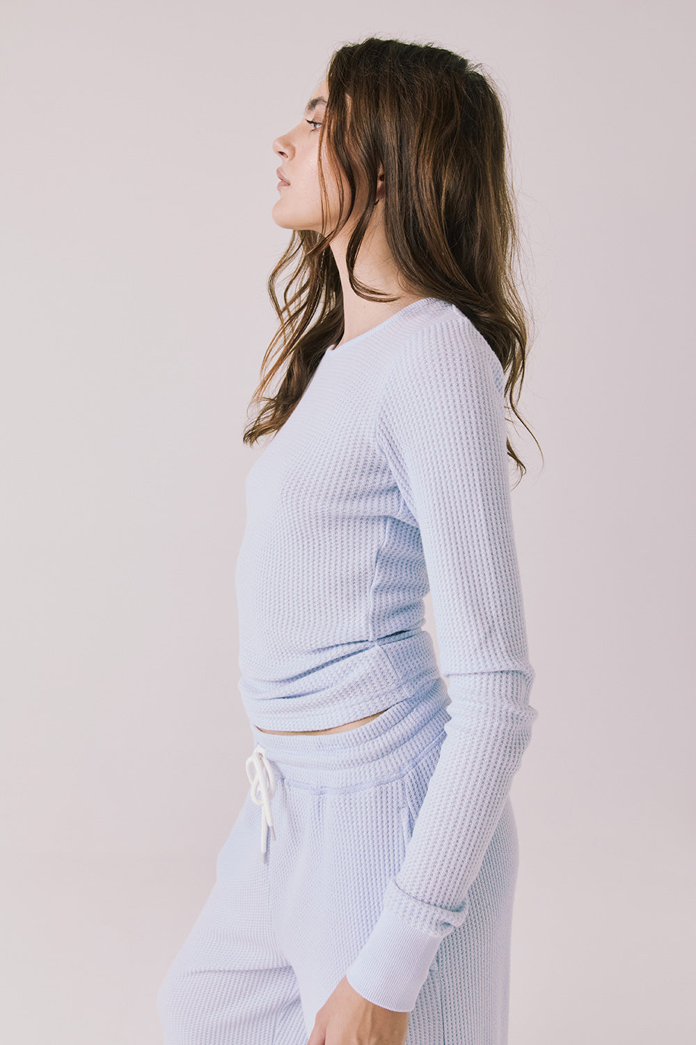 Side view of woman wearing Chaser’s Spritz Long Sleeve on a white background