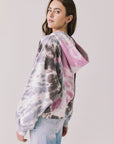 Back view of woman wearing Chaser’s Heart Tie Dye Zip Up Hoodie on a white background