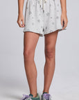 Model wearing Chaser's Twilight Shorts in Heather with scattered black stars and spark details, front view