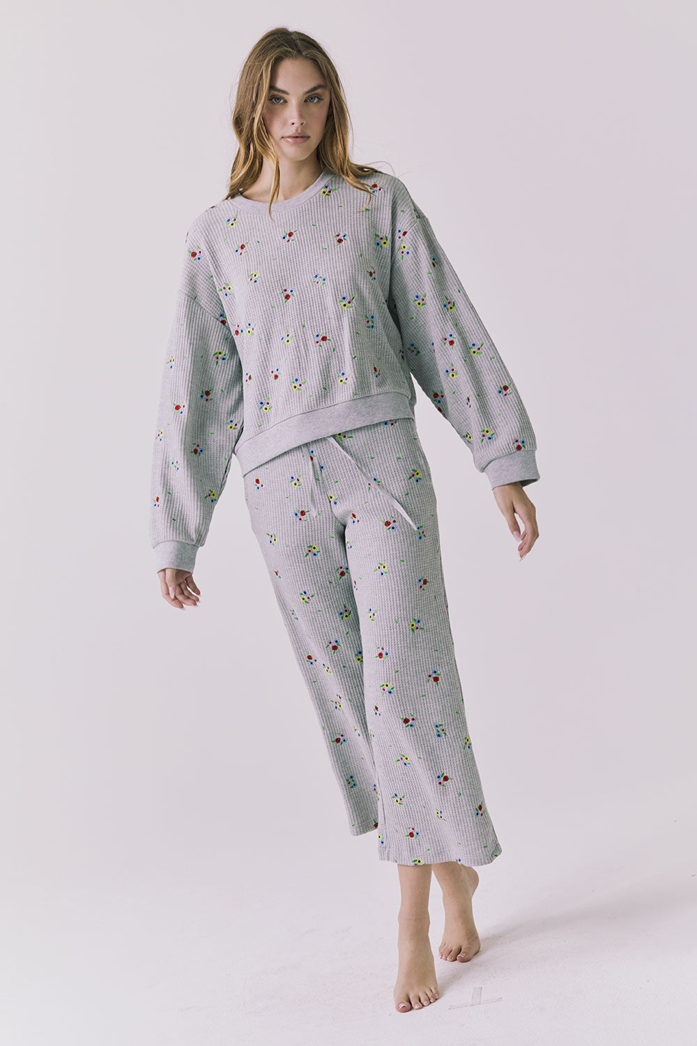 Full body view of the Chaser Brandy Heather Grey Ditsy Embroidery Crop Joggers styled with the matching Terra Pullover for an effortless coordinated lounge look