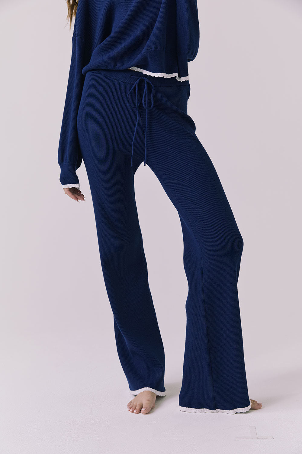 Angled lower body view of the Sailor Worn Blue Joggers highlighting the ribbed fabric and relaxed straight-leg fit