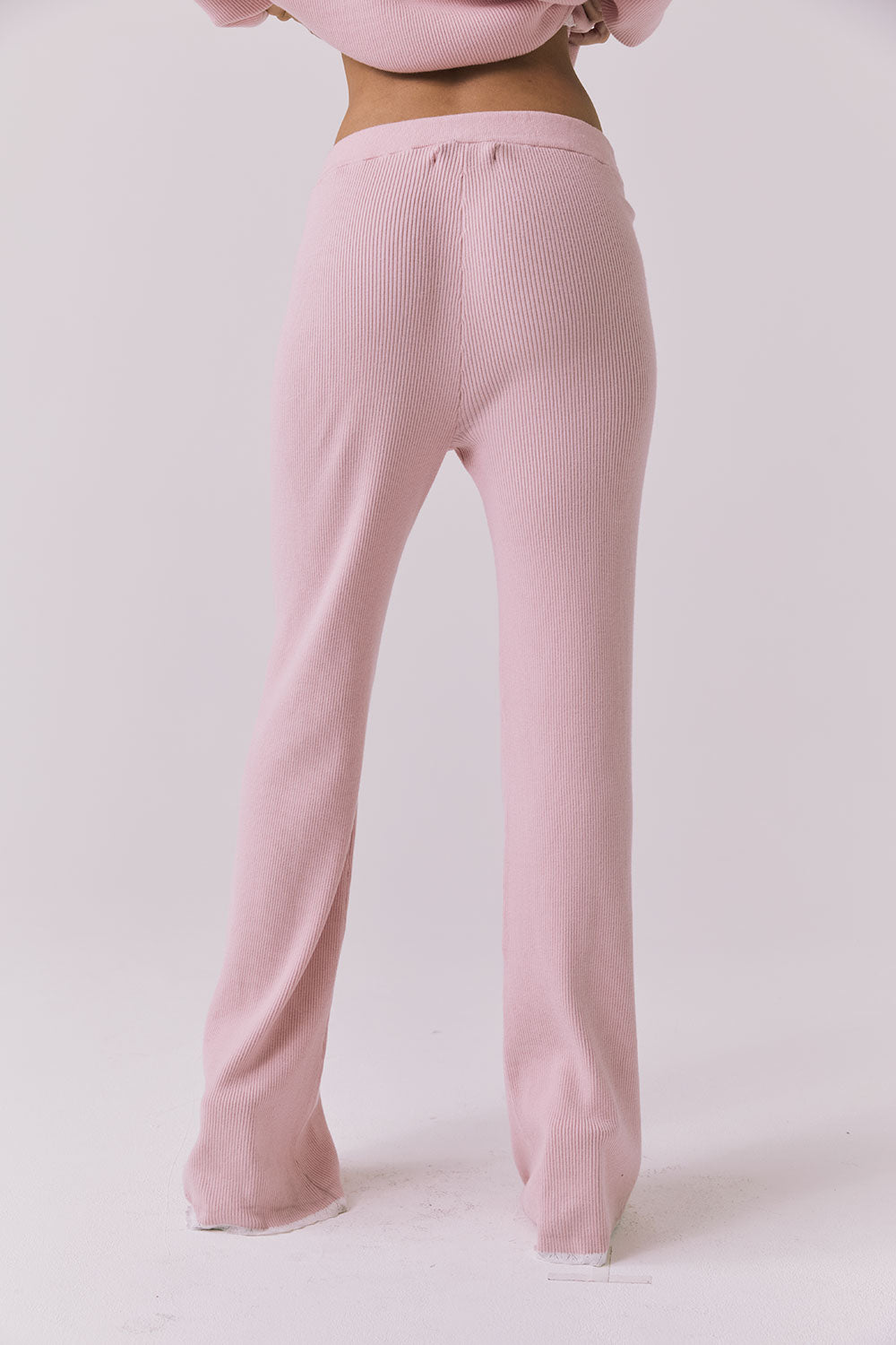 Back view of the Chaser Sailor Pink Salt Joggers in Pink Salt showing the ribbed fabric and clean back silhouette
