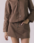 Chaser Sloane Cognac Wash Mini Skirt front view showing button-front closure and washed denim texture