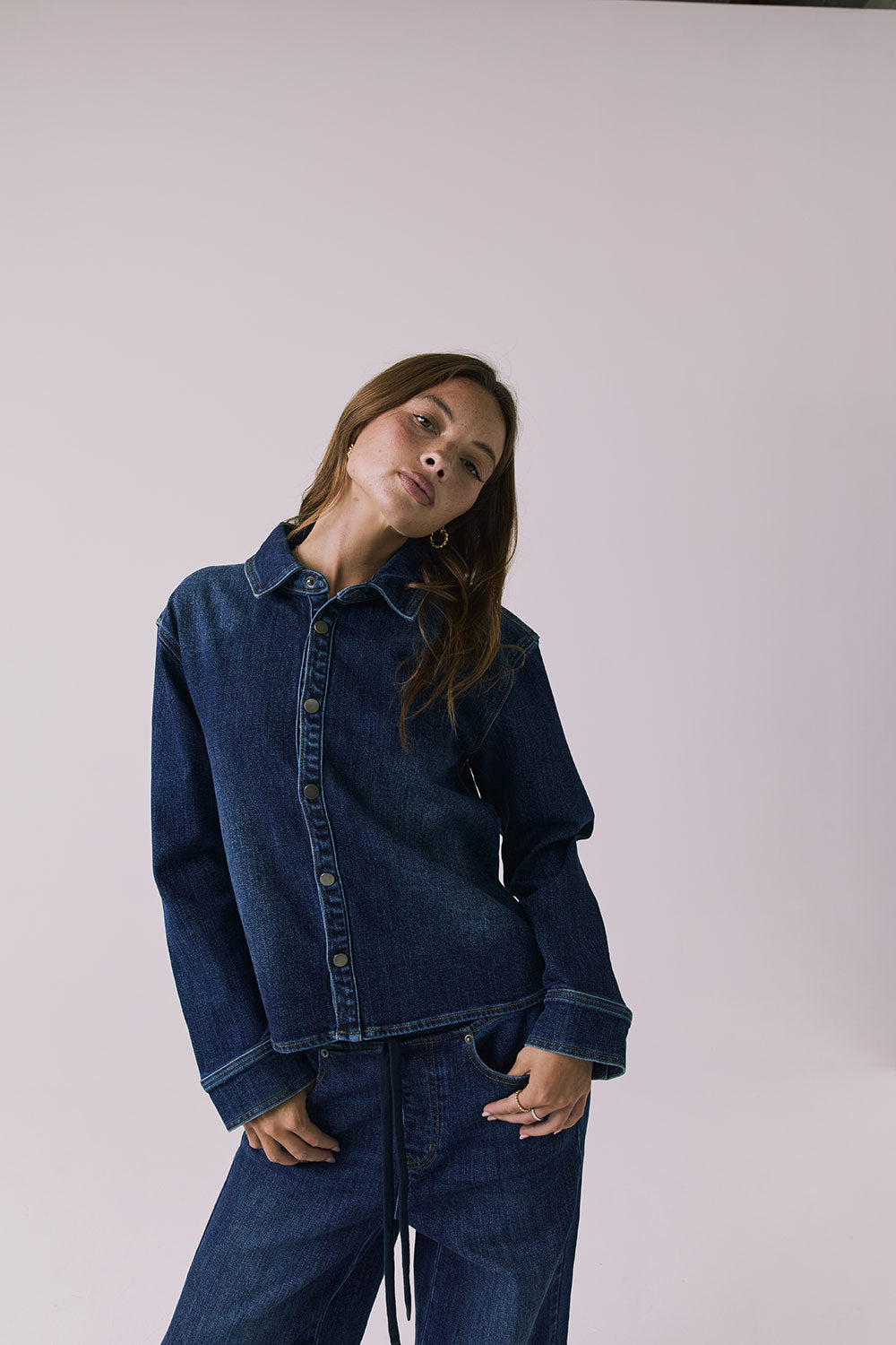 Chaser All Day Indigo Wash Button Down in Indigo Wash captured in a long portrait view with clean lines and subtle fading