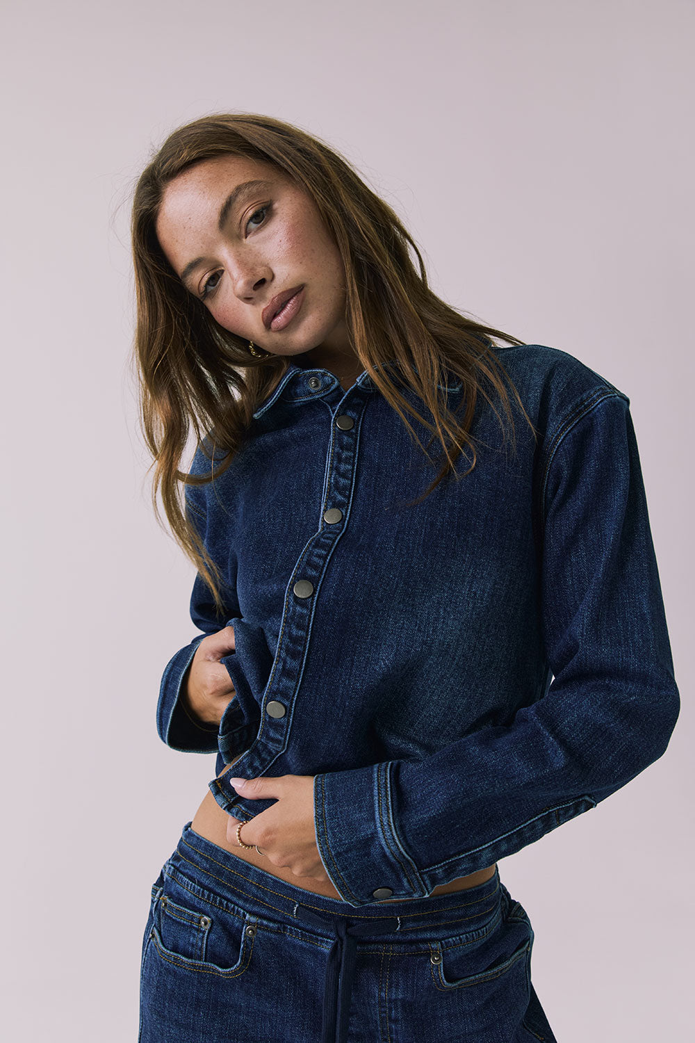 Chaser All Day Indigo Wash Button Down in Indigo Wash captured in a soft studio close-up with textured denim and snap-button detailing