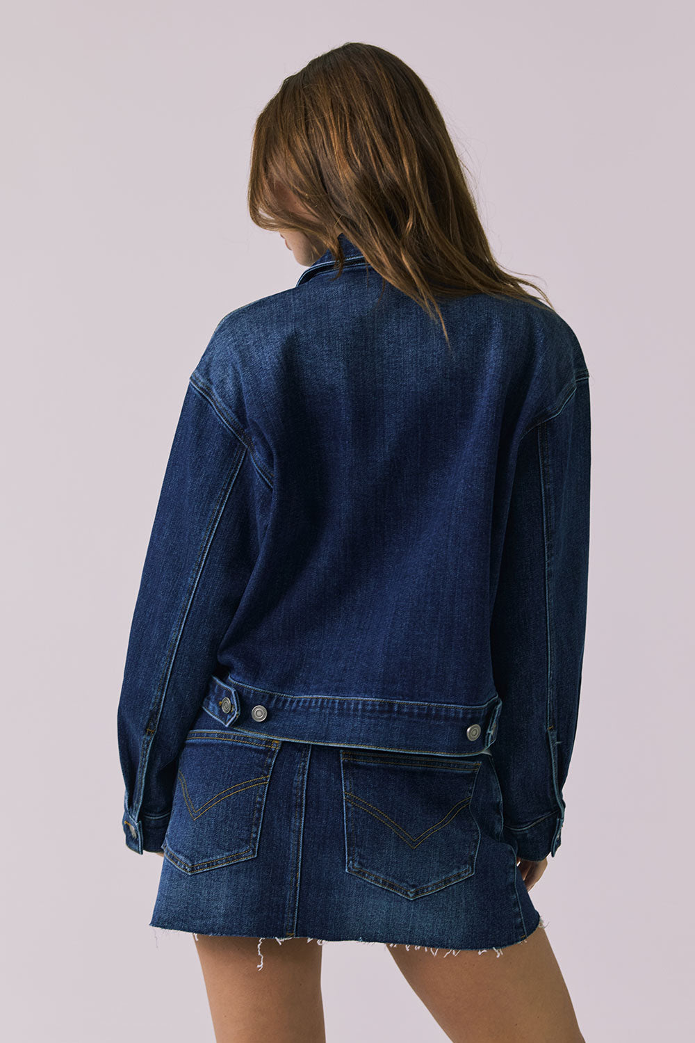 Back view of the Chaser Sutton Indigo Wash Jacket showing clean denim construction and relaxed silhouette