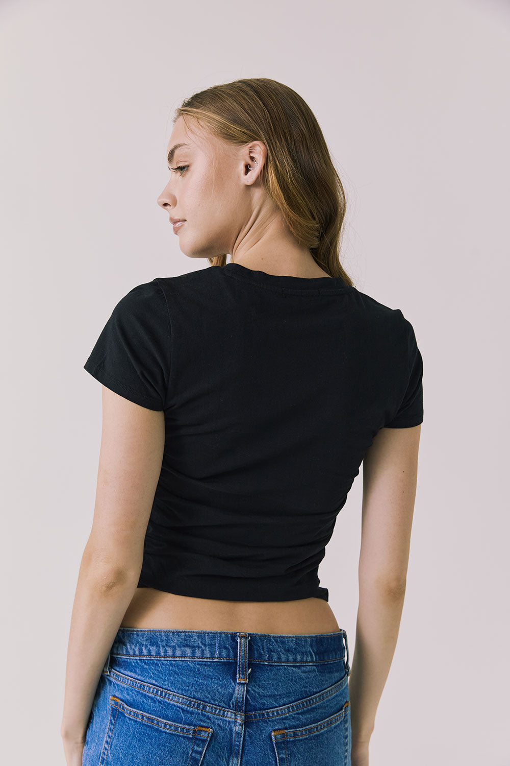 Back view of the Chaser Louis Black Tee showing a clean neckline and smooth fitted back