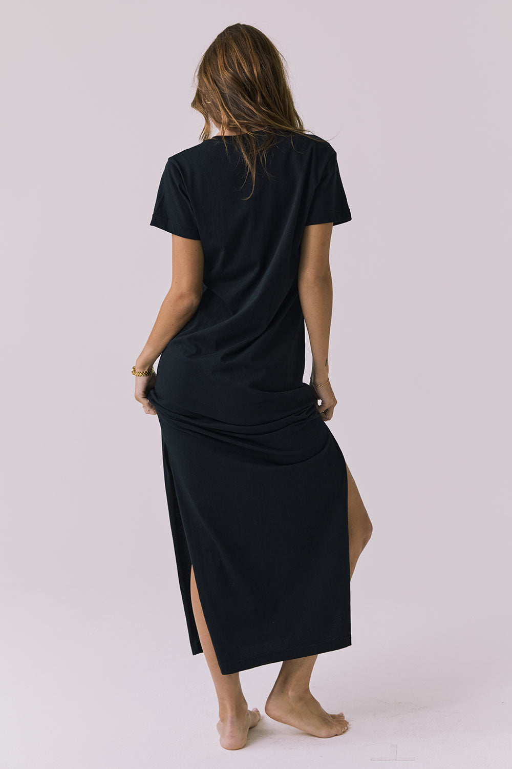 Back view of the Chaser Winslet Maxi Dress in True Black showing a clean solid back and easy drape through the skirt