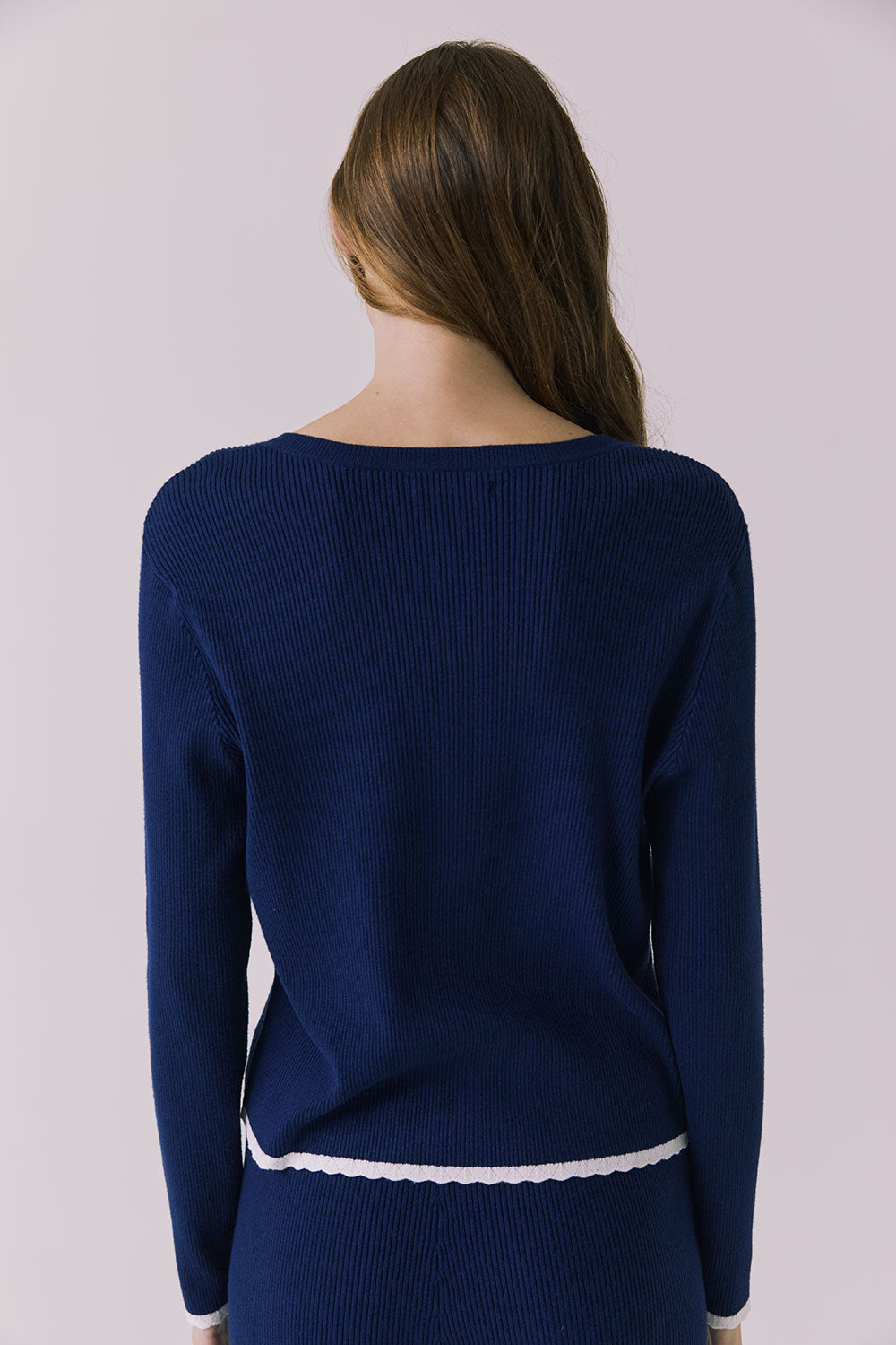 Back view of the Chaser Seaport cardigan in Worn Blue showing ribbed fabric and hem finish styled with matching Sailor joggers
