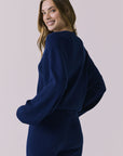 Over the shoulder back view of the Chaser Rhode Worn Blue Pullover showing the ribbed texture and relaxed back fit