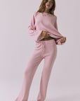Full body view of the Chaser Rhode Pink Salt Pullover styled with the matching Sailor Pink Salt Joggers on a neutral studio background