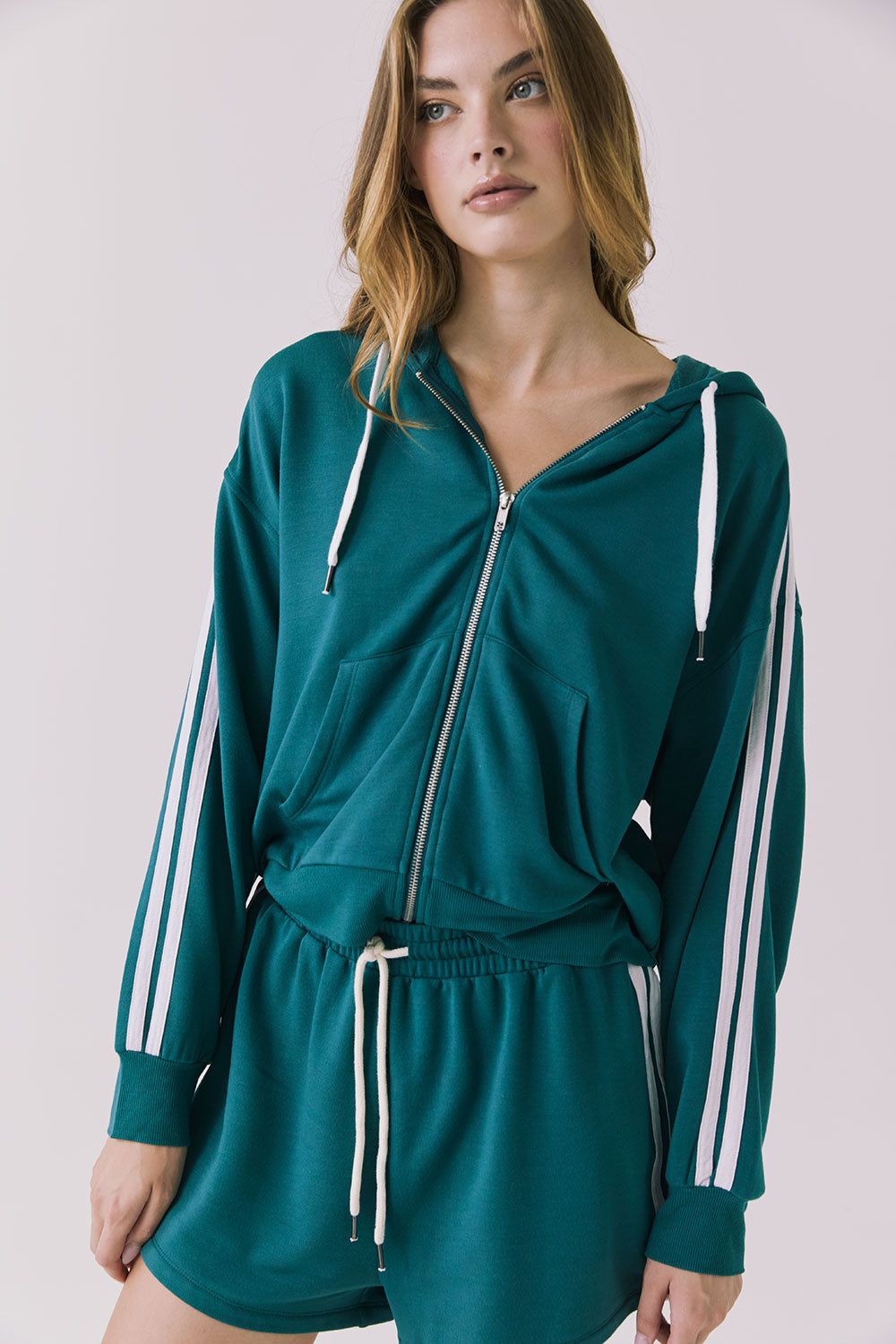 Chaser Abilene Teal Zip-Up Hoodie with White Stripes captured in a close up of the neckline and shoulder stripes