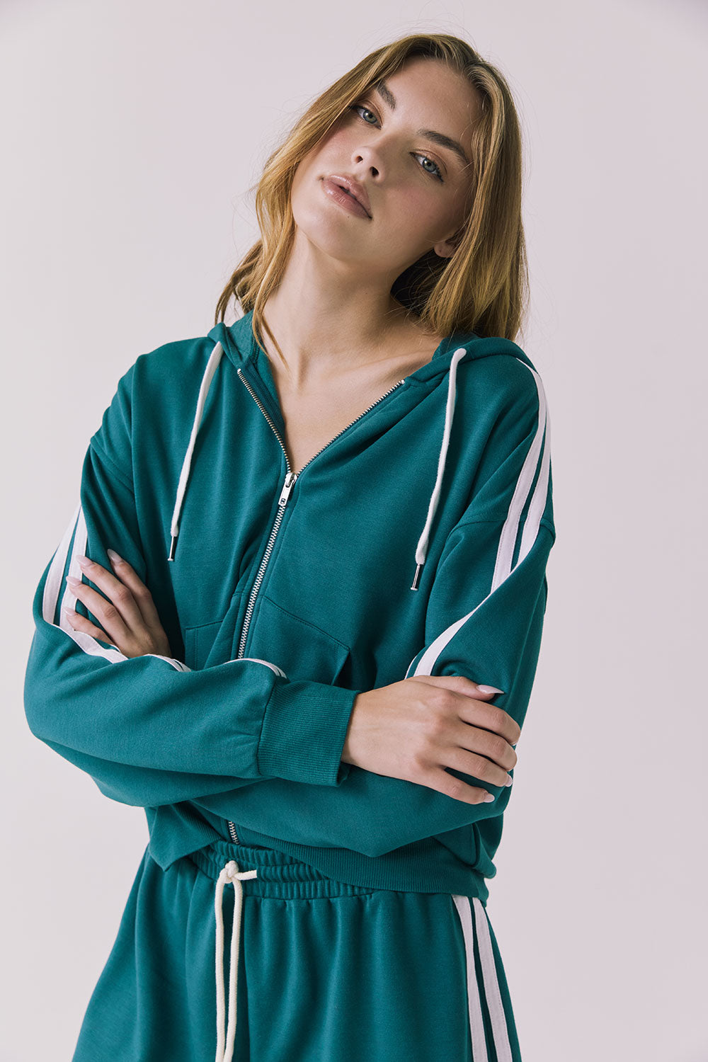 Chaser Abilenee Teal Zip Up with White Stripes in a soft front portrait shot highlighting the hood and stripe details